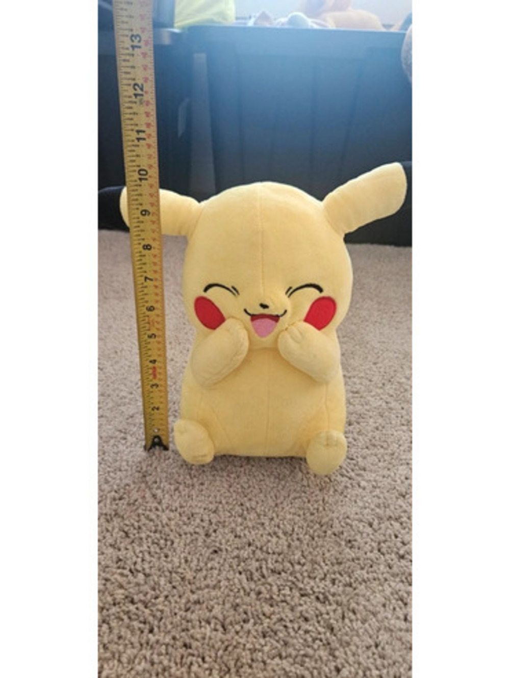 Large smiling Pikachu stuffed animal